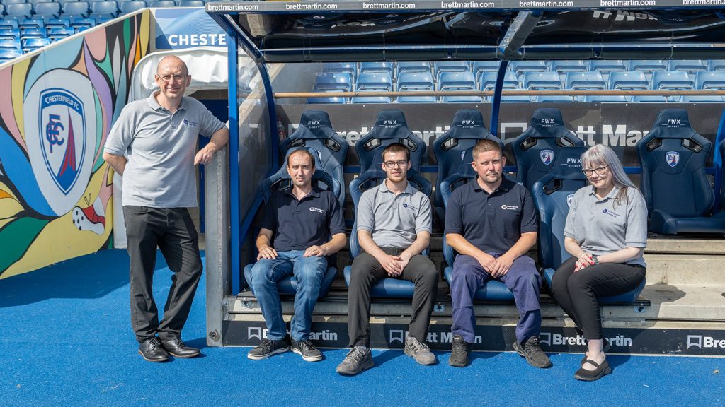 4 people from West special fasteners sat in the dug outs pitch side for CFC