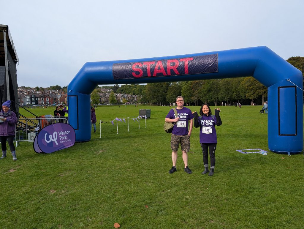 2 colleagues stand by the start line ready to go