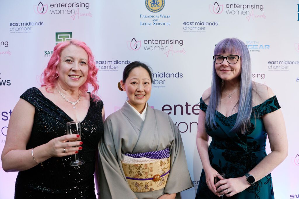 Enterprising Women Awards backdrop with 3 women
