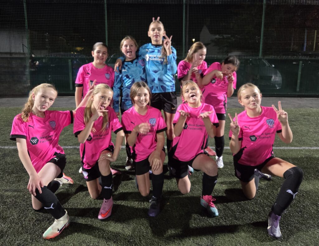u12 girls gold football team pose in their shirts sponsored by West Special Fasteners