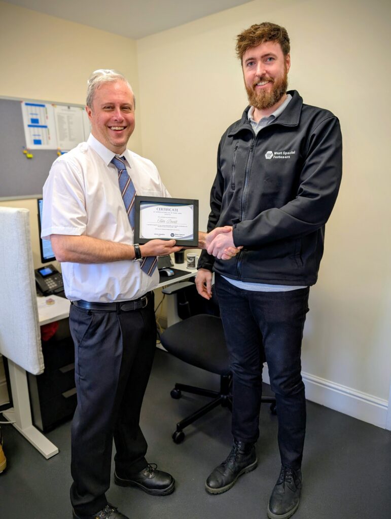 2 colleagues Handing out long service awards