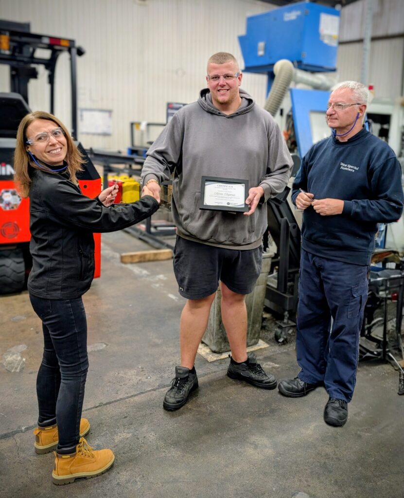 3 colleagues Handing out long service awards