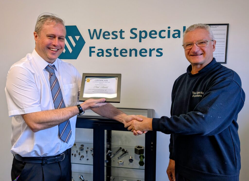 2 colleagues Handing out long service awards