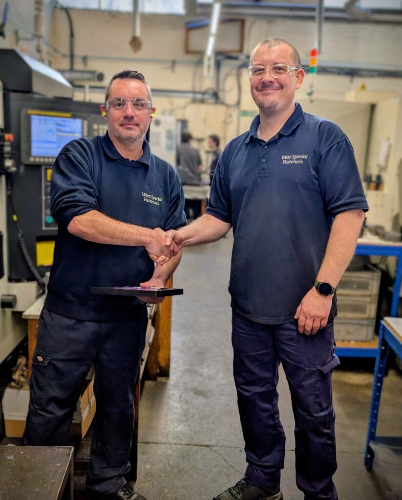 2 colleagues Handing out long service awards